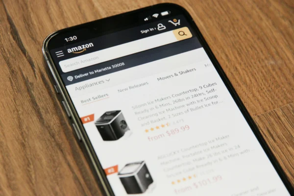Phone screen showing an Amazon product listing with ratings and price.