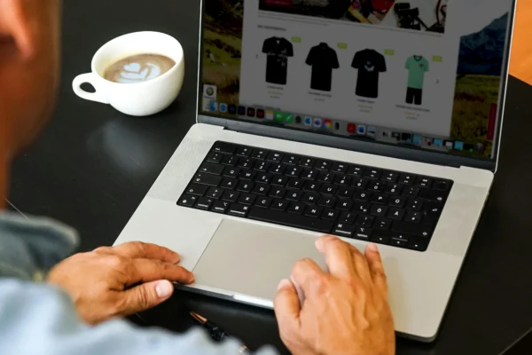 Person working on laptop reviewing e-commerce store data